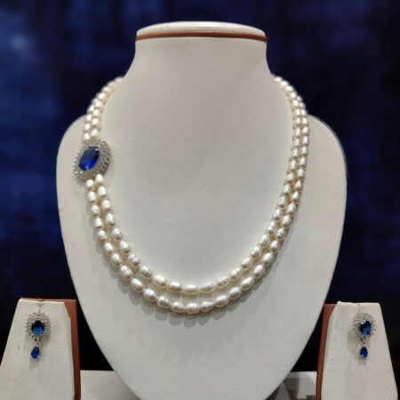 Double-line pearls set with a stylish side pendant, perfect for weddings and formal occasions.