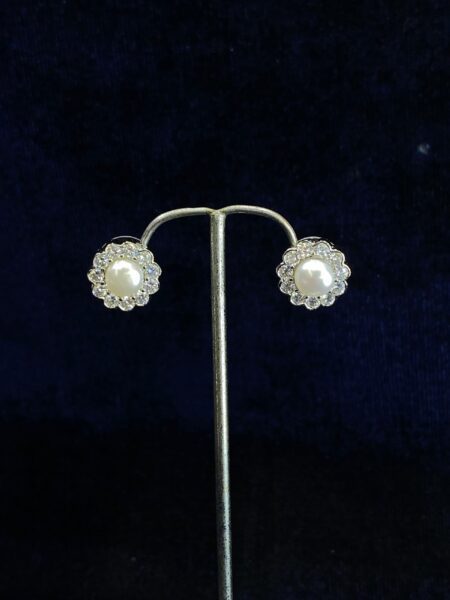 Floral Halo Pearl Studs with delicate floral detailing.