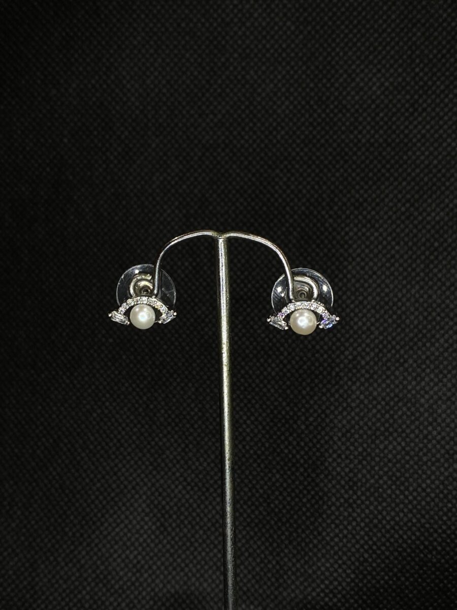 Pearl Wing Studs featuring a delicate wing design with a central pearl.