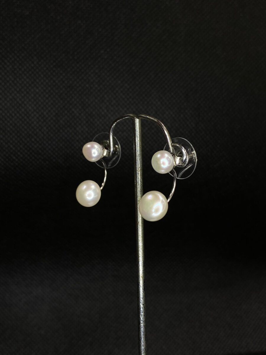 Double Take Pearl Studs with a unique two-pearl design.