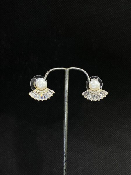 Fanfare Pearl Studs with a bold and unique design.
