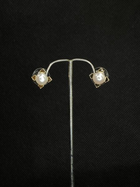 Pearl Wing Earrings with a graceful wing design and a lustrous pearl accent.