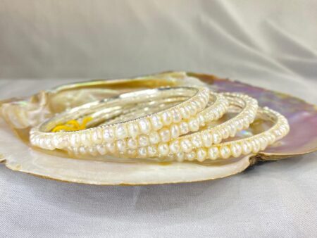 Elegant White Pearl Bangle with smooth, lustrous pearls set in a classic and timeless design.