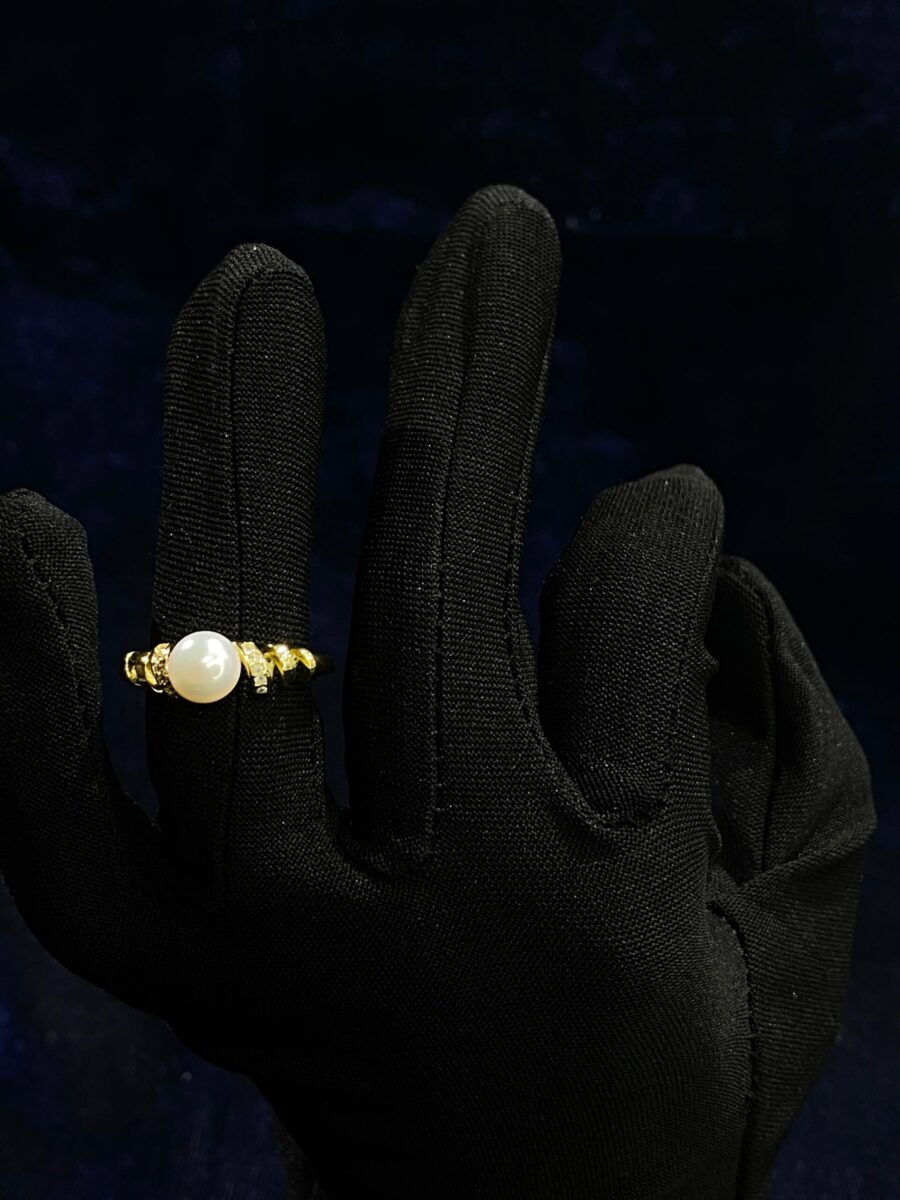 Pearl Cascade Ring with an elegant cascading design of luminous pearls.