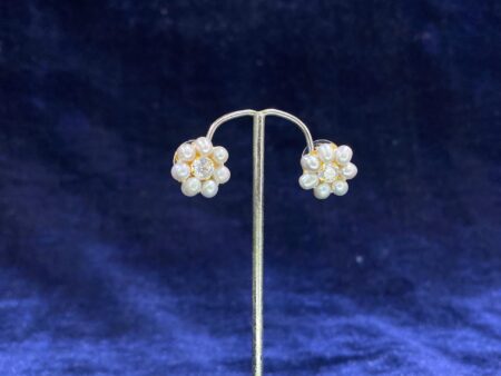 Pearl Daisy Stud Tops with a charming daisy-inspired floral design and pearl center.