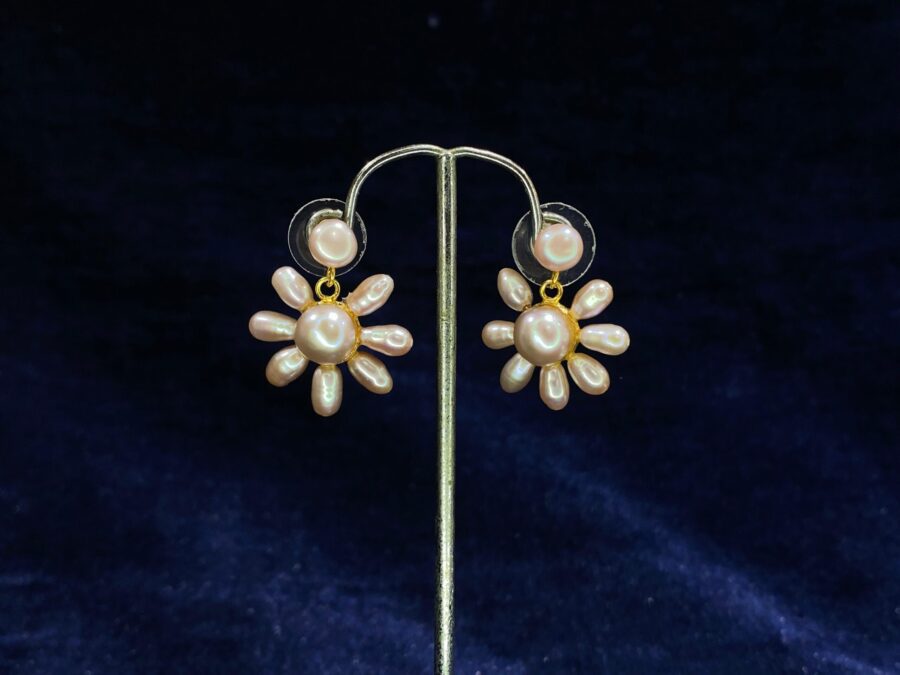 Pearl Blossom Drop Earrings featuring a radiant floral-inspired design for timeless beauty.