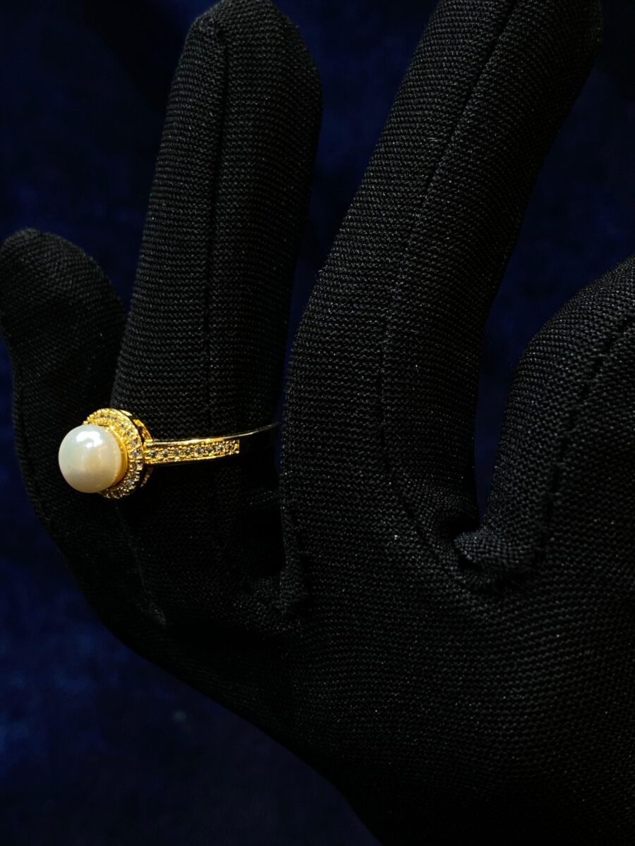 Pearl Solitaire Ring with a single radiant pearl centerpiece.