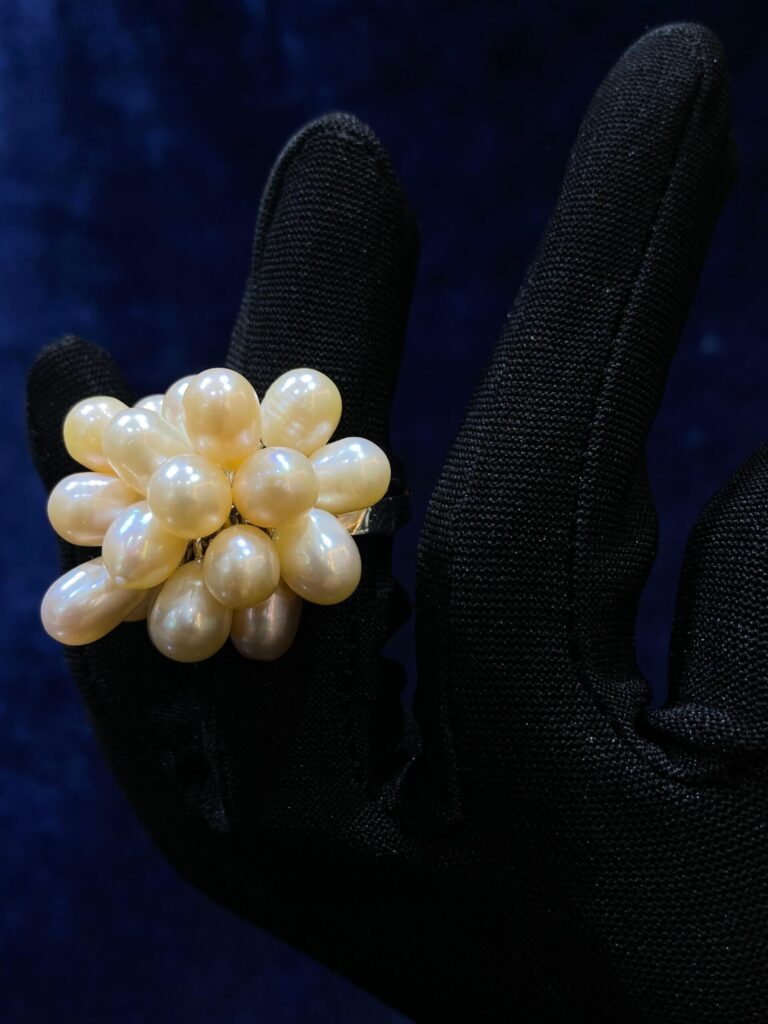 Pearl Cluster Ring with lustrous pearls in an elegant arrangement.