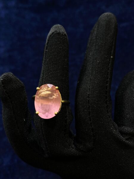 Pink Quartz Elegance Ring featuring a polished pink gemstone in a sleek design.