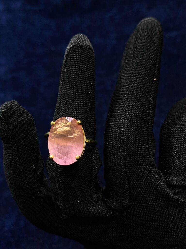Pink Quartz Elegance Ring featuring a polished pink gemstone in a sleek design.