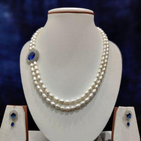 Double-line pearls set with a stylish side pendant, perfect for weddings and formal occasions.