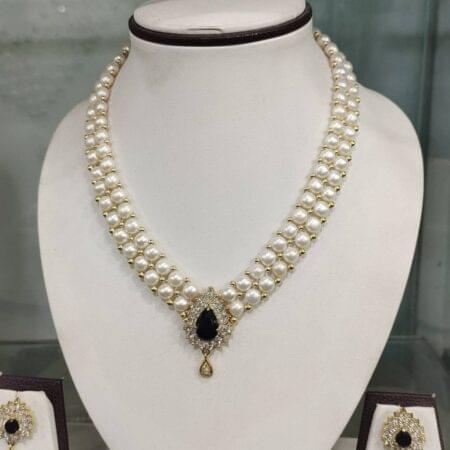 Unique gem pearl designer necklace set, featuring colorful gemstones and radiant pearls for a vibrant yet elegant look.