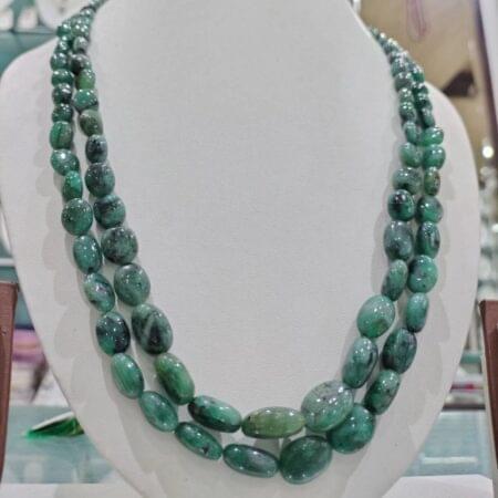 Elegant Two Line Emerald Set featuring rich emerald stones and pearls for a luxurious and sophisticated look.