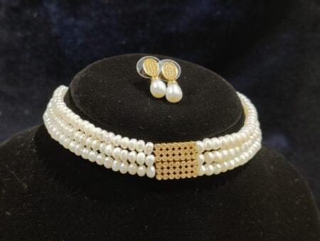 Exquisite choker pearls set with a timeless design, perfect for elegant and formal occasions.