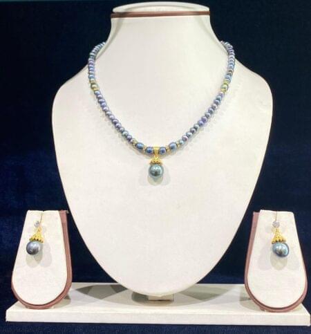 Elegant single-line pearl set in vibrant dye color, offering a stylish and modern design for a bold and luxurious look.