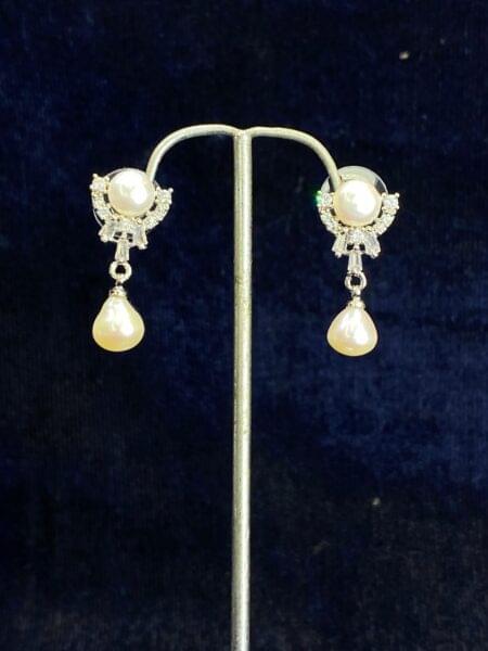 Pearl Cascade Studs featuring a unique cascading design for modern elegance.