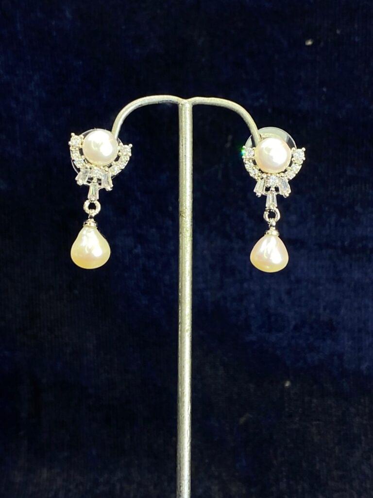Pearl Cascade Studs featuring a unique cascading design for modern elegance.