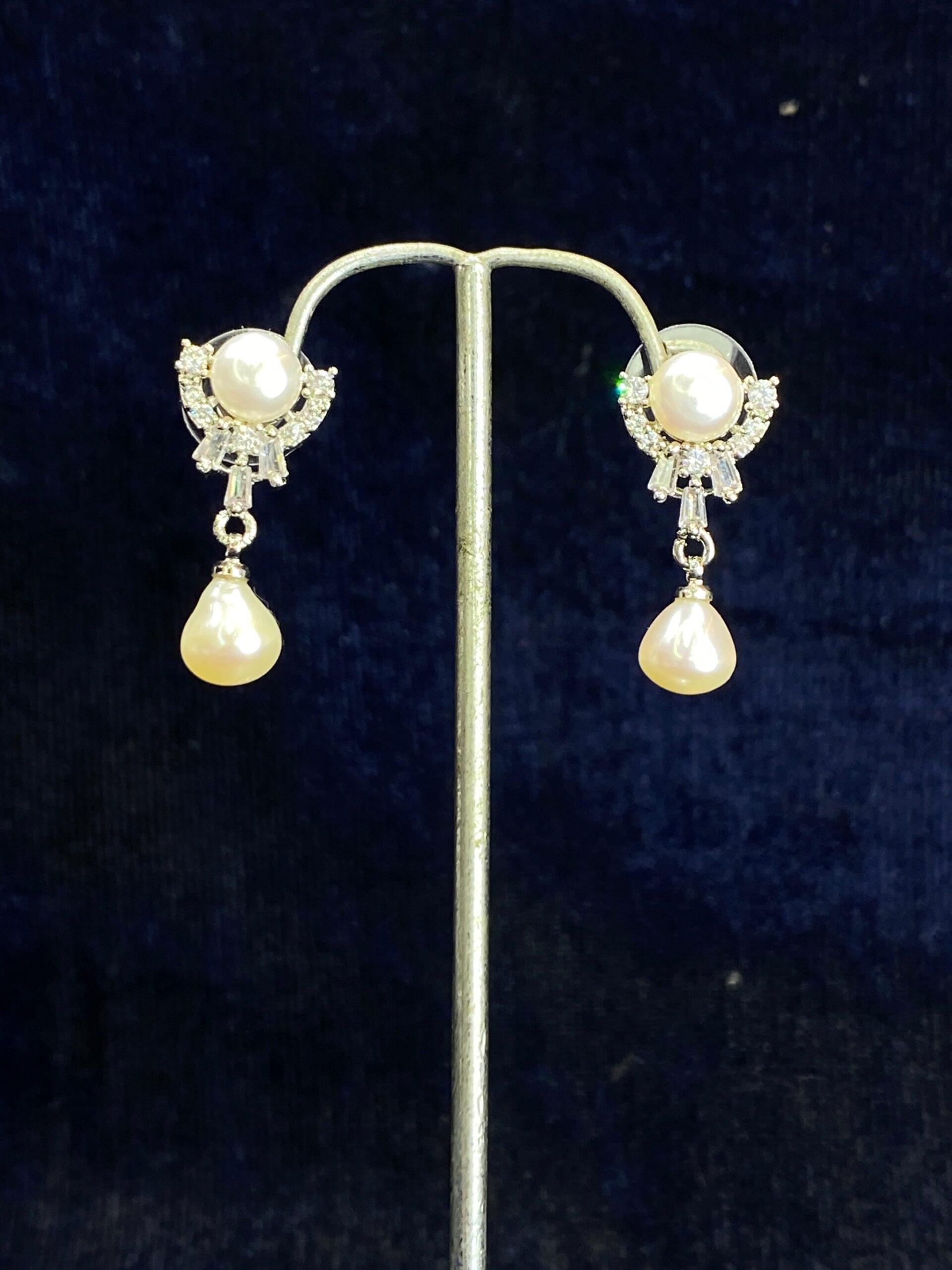 Pearl Cascade Studs featuring a unique cascading design for modern elegance.