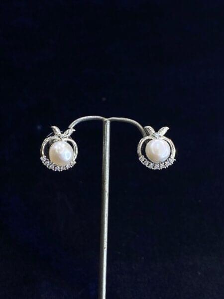 Apple Blossom Pearl Studs with intricate blossom detailing.
