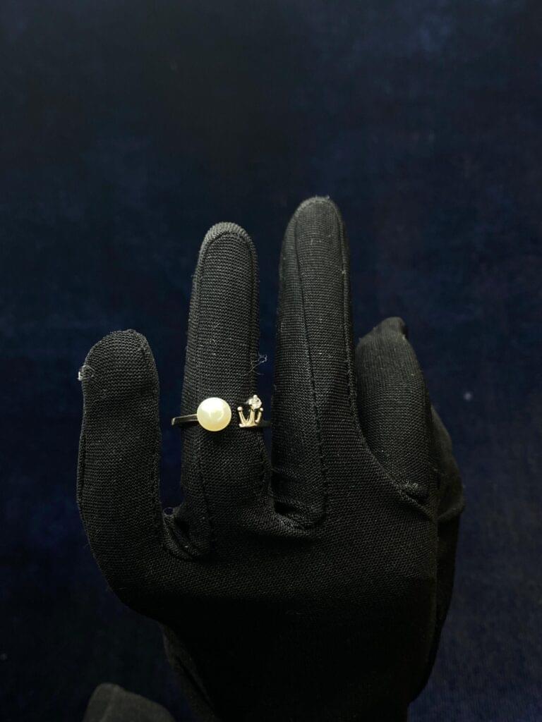 Royal Pearl Ring with a majestic pearl centerpiece and regal design.