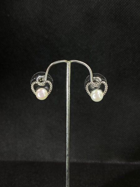 Twisted Heart Pearl Studs with a romantic heart design and central pearl.