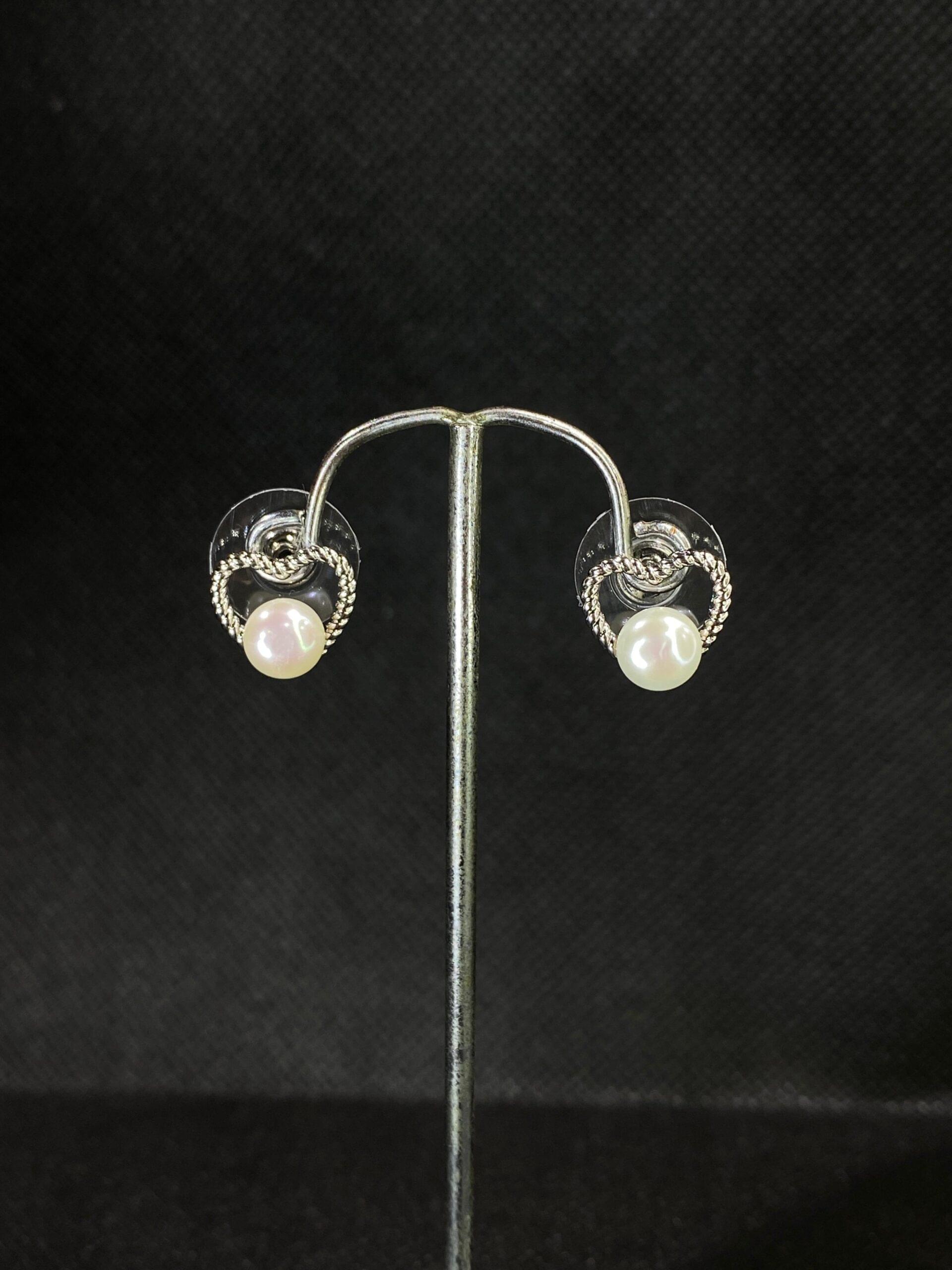 Twisted Heart Pearl Studs with a romantic heart design and central pearl.