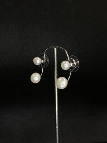 Double Take Pearl Studs with a unique two-pearl design.
