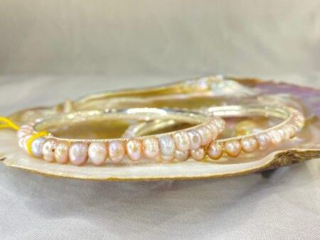 Elegant Lavender Pearl Bangle featuring soft lavender pearls set in a delicate and sophisticated design.