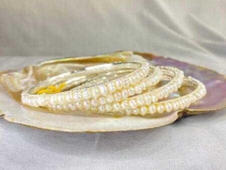 Elegant White Pearl Bangle with smooth, lustrous pearls set in a classic and timeless design.
