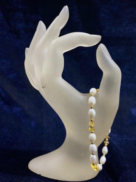 Golden Pearl Harmony Bracelet with lustrous golden pearls and elegant design.
