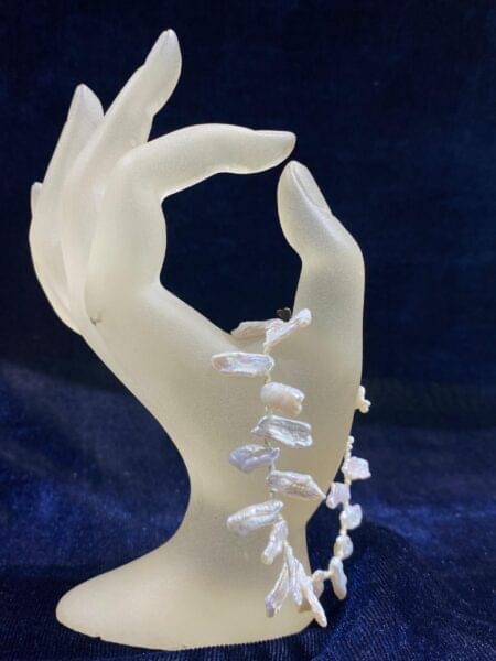 Pearl Cascade Bracelet with cascading layers of shimmering pearls.