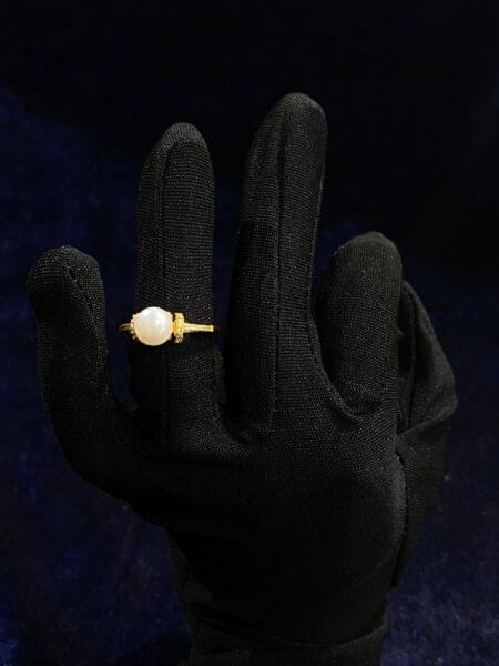 Pearl Accent Ring with a radiant pearl detail and minimalistic design.