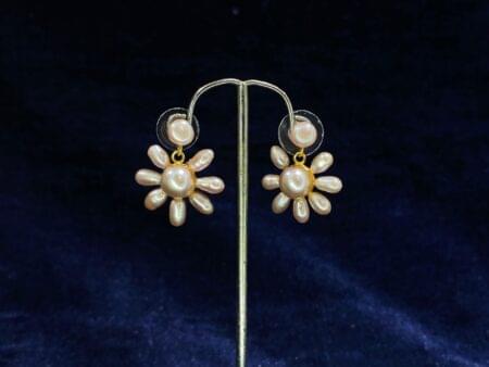 Pearl Blossom Drop Earrings featuring a radiant floral-inspired design for timeless beauty.
