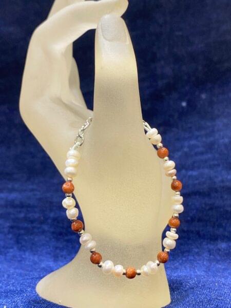 Pearl and Sunstone Bracelet featuring lustrous pearls paired with vibrant sunstone beads for a radiant, elegant look.