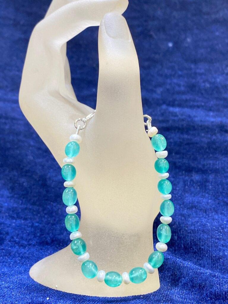 Turquoise and Pearl Bracelet combining vibrant turquoise stones with radiant pearls.