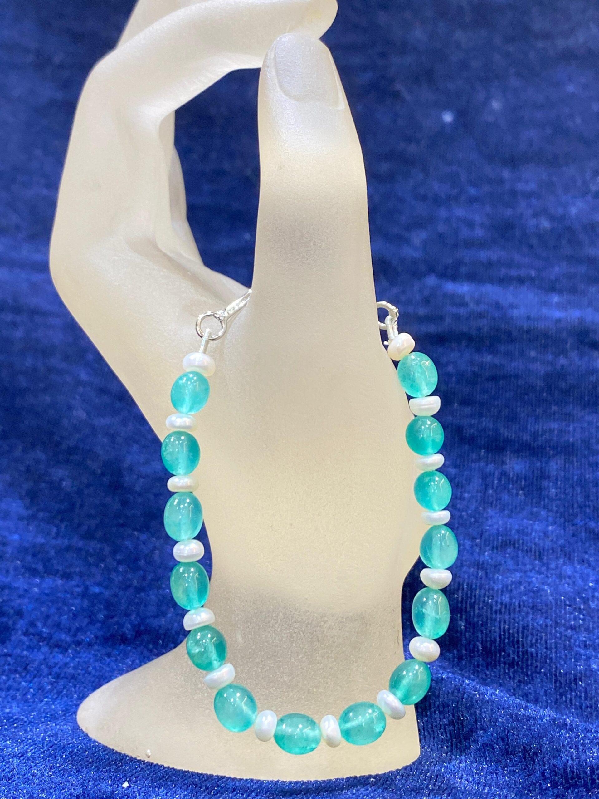 Turquoise and Pearl Bracelet combining vibrant turquoise stones with radiant pearls.