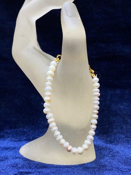 Classic Pearl Bracelet showcasing timeless elegance with luminous pearls.