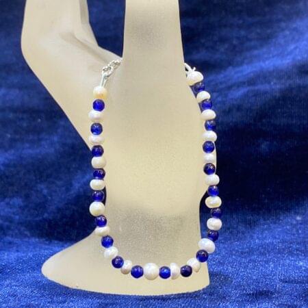 Luxurious Pearl and Sapphire Bracelet showcasing radiant pearls and vibrant sapphires for a timeless look.
