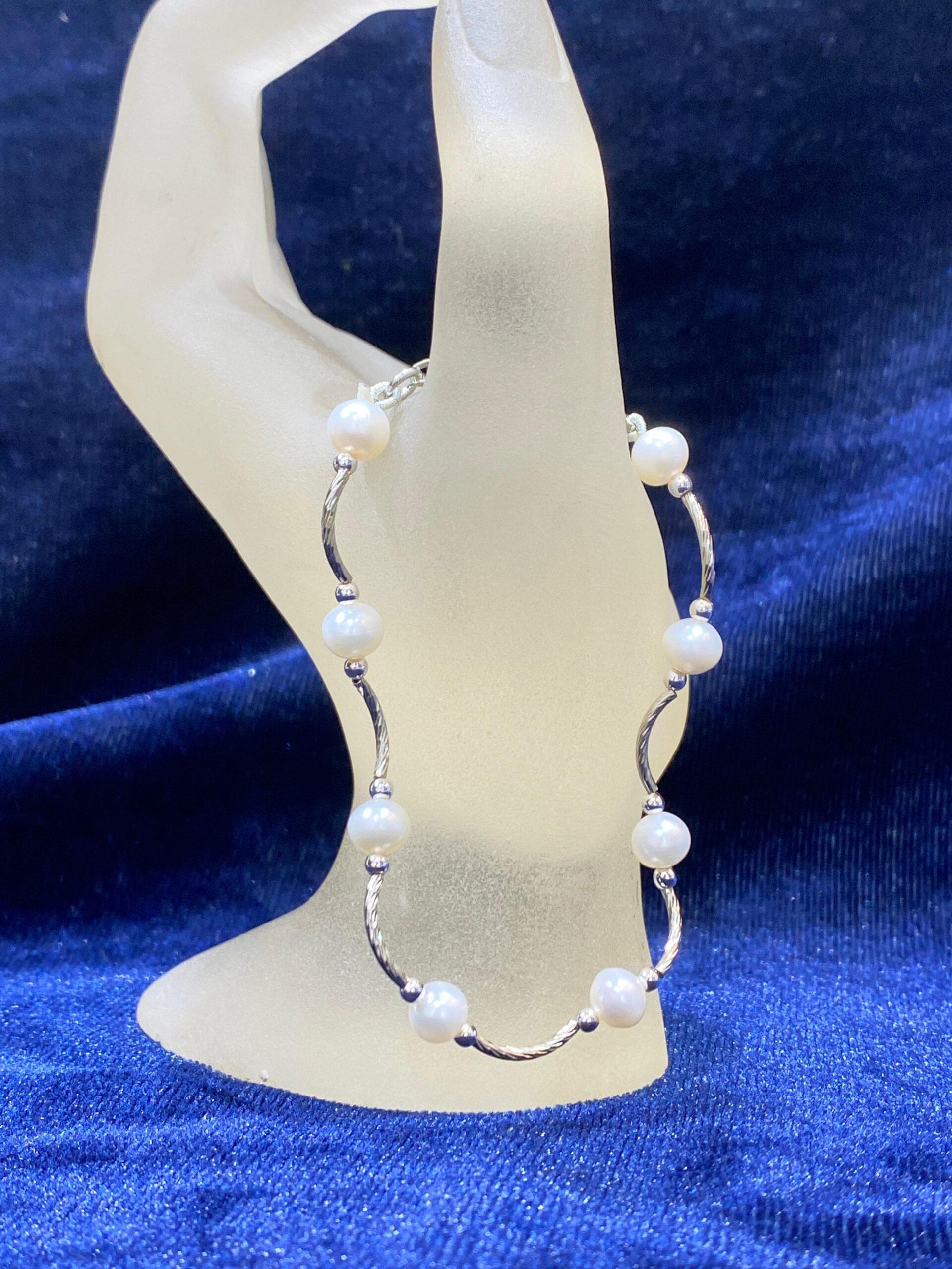 Wavy Pearl Bracelet with an elegant wave design accentuating radiant pearls.