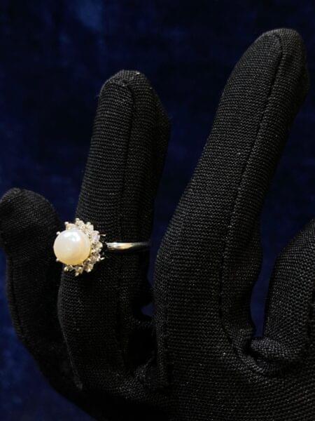 Pearl Halo Ring with a radiant pearl surrounded by sparkling accents.